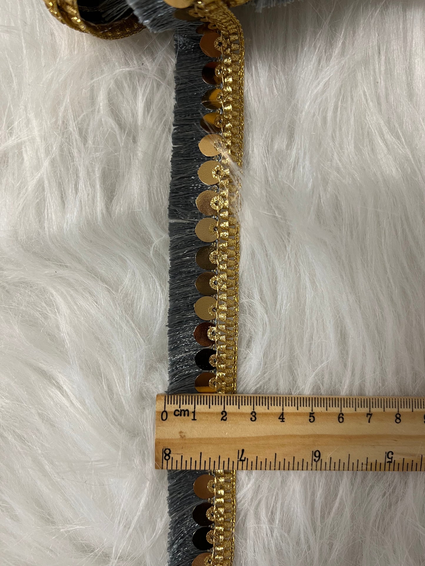 Galon sequin à franges gris doré